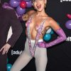 Miley Cyrus shows her breasts in a mesh top at the Adult Swim Upfront Party 5
