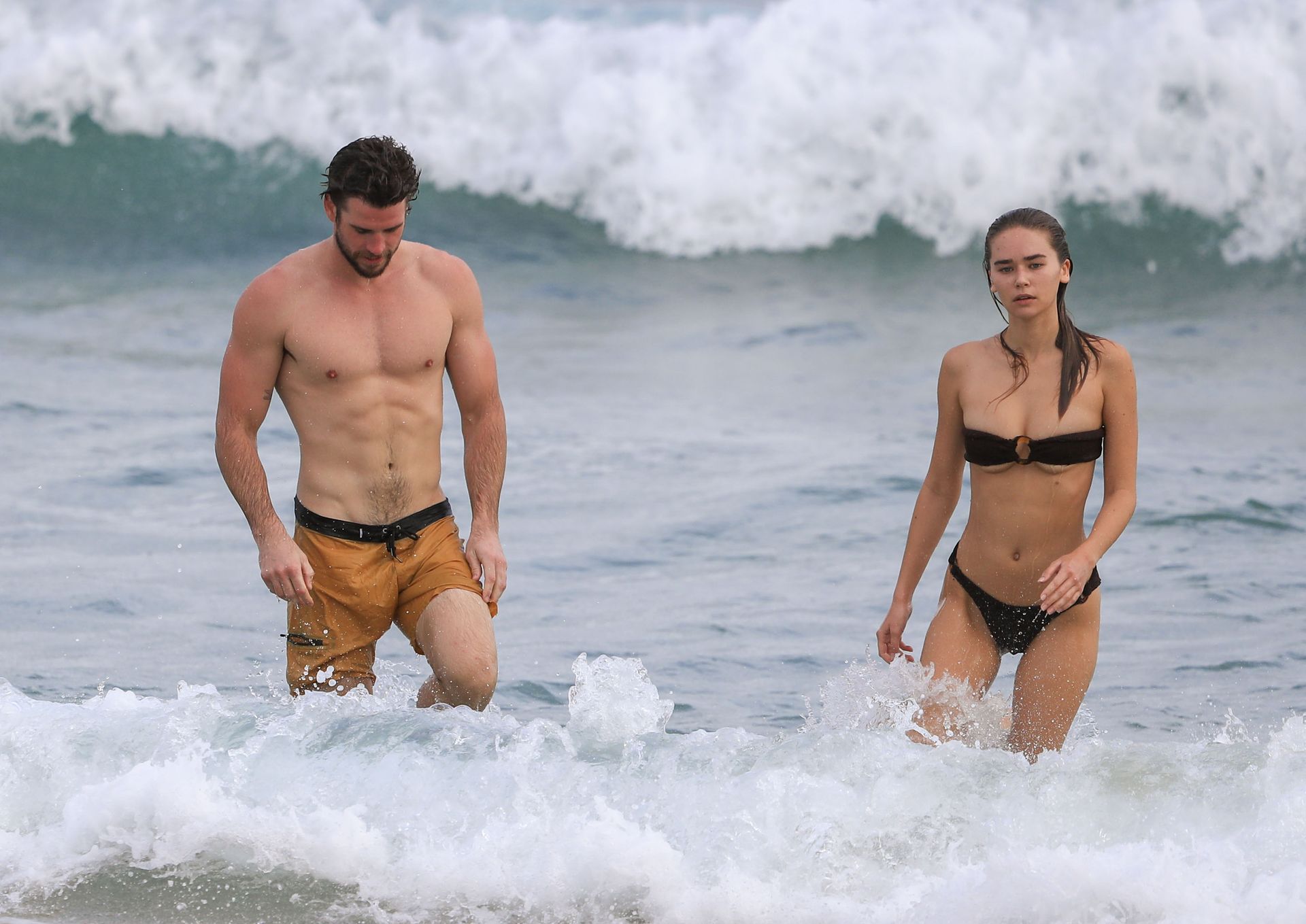 Liam Hemsworth Shows Off His Ripped Beach Bod During A Morning Swim With Gabriella Brooks In Byron Bay 0001