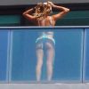 Cindy Prado Shows Off Her Curves In A Small Blue Bikini As She Works Out On A Balcony In Miami 0017