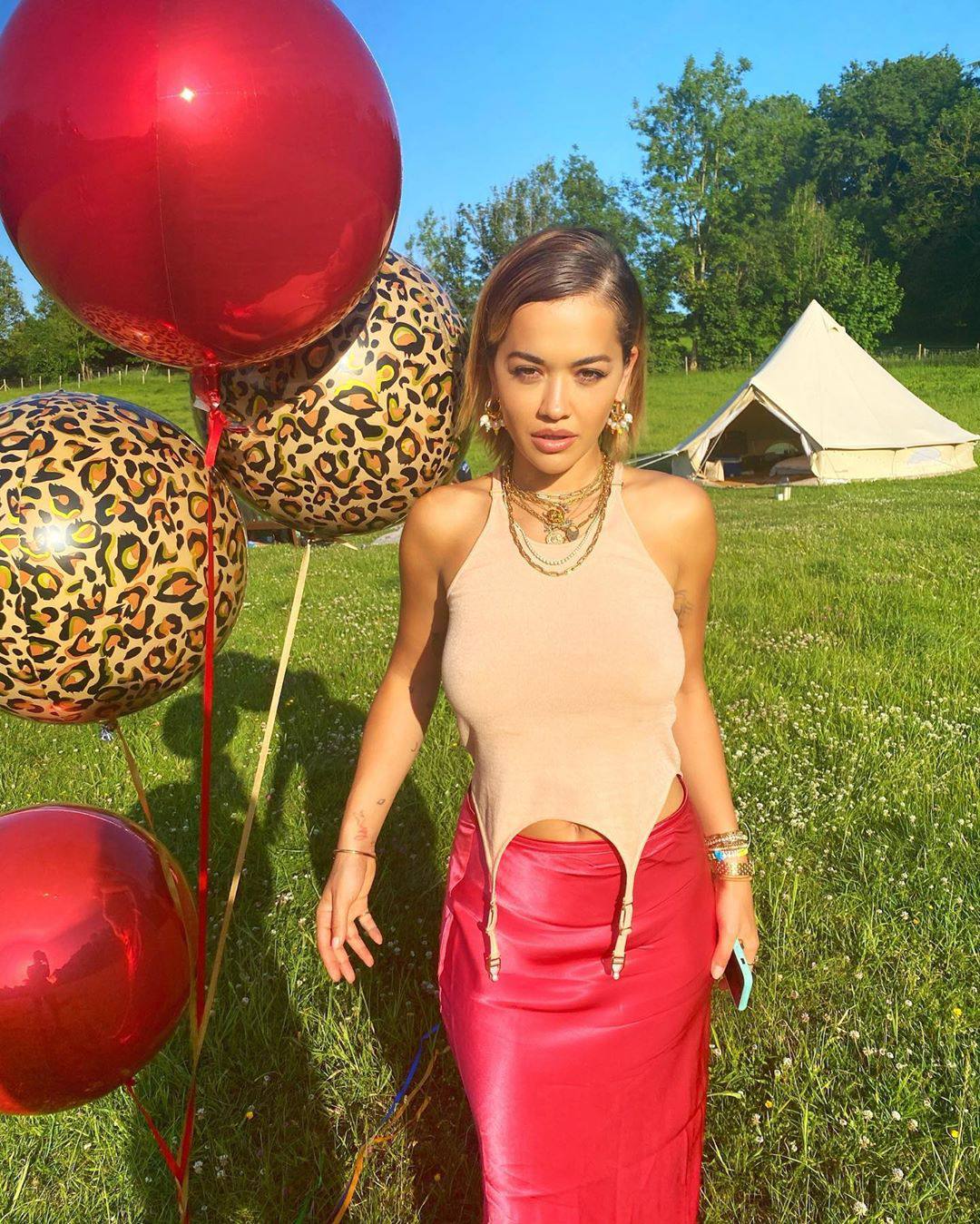 Rita Ora – Sexy Boobs In Braless Photoshoot At Balloon Party 0001